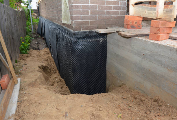 SJ Waterproofing Pros technician performing targeted Waterproofing assessment in Clinton, SC